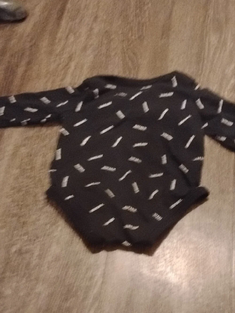 Black Infant Long Sleeve Onesie In Size Newborn